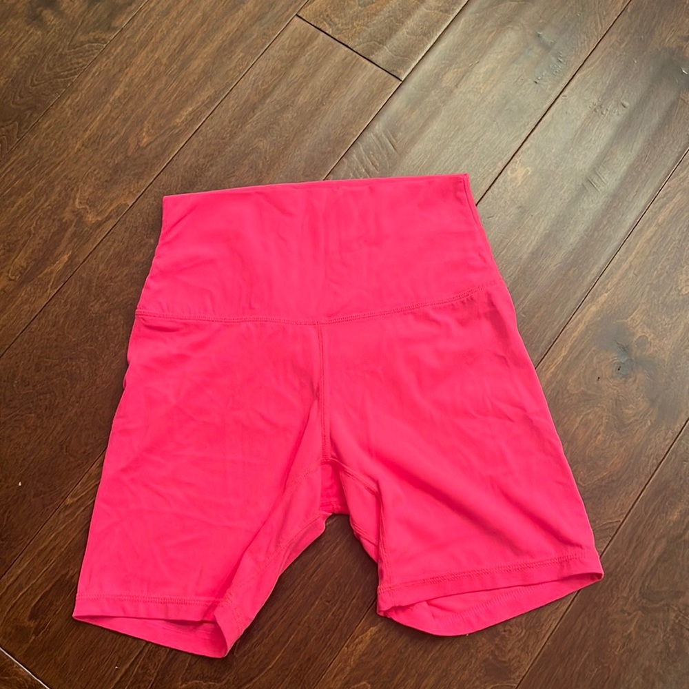 Women’s size small neon pink soft bike shorts about 6”
